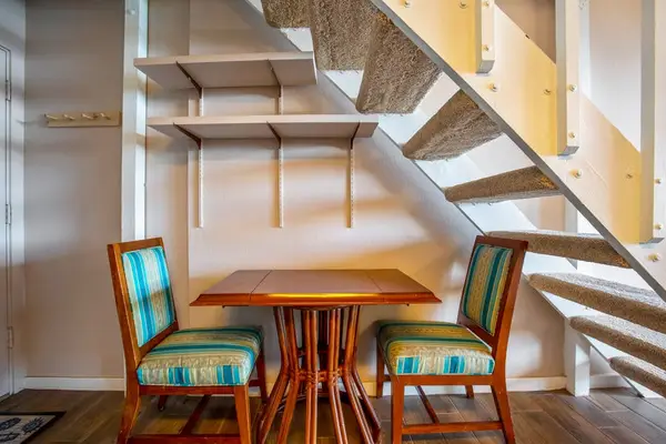 Bistro table for extra seating underneath the stairs.