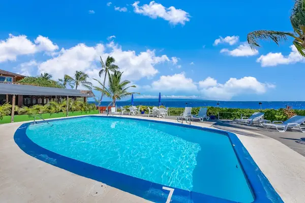 Island resort exteriors feature tropical landscaping and welcoming guest pathways