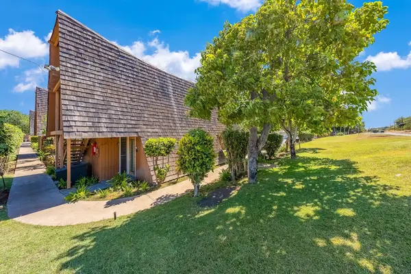 Sunny tropical grounds frame charming cottage architecture and gentle breezes