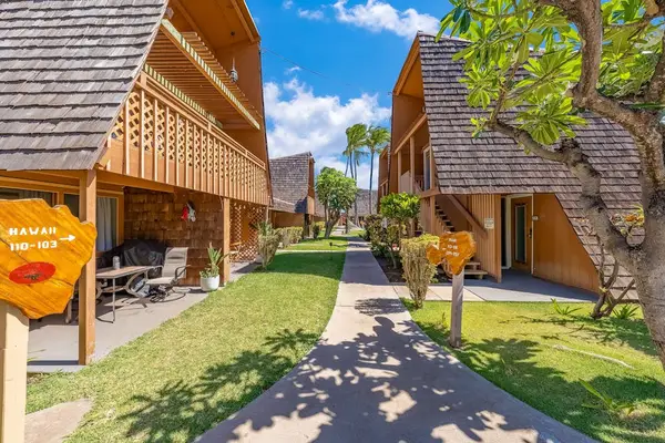 Island grounds provide a welcoming approach with palms and sunshine