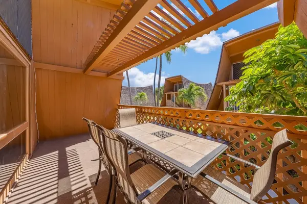 Balcony offers outdoor seating with greenery and ocean breeze