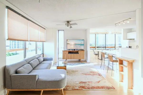 Enjoy a bright and open living space featuring a stunning glass wall that brings in natural light.