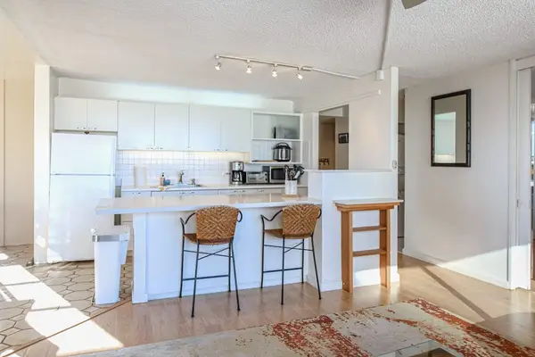 Enjoy extra space for meal preparation, dining, and gathering around the stylish kitchen island.