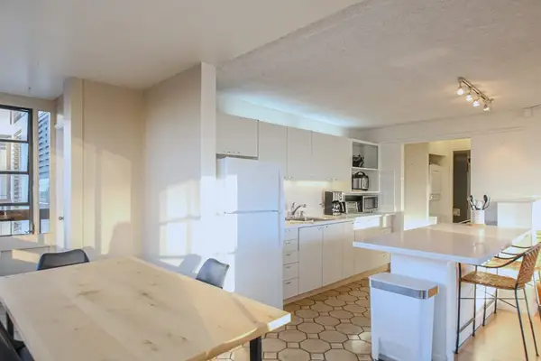 A bright and spacious area designed for shared meals, relaxation, and everyday convenience.