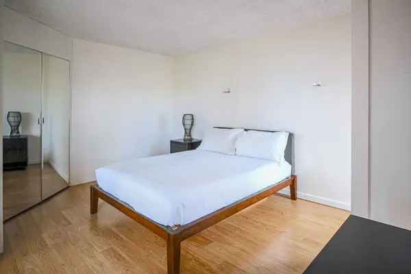 Enjoy peaceful nights in a cozy room with a comfortable queen-size bed.