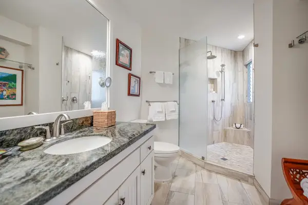 Spacious bathroom with a double vanity and elegant finishes.