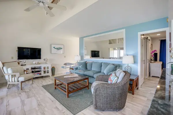 Spacious living room filled with natural light and ocean views.