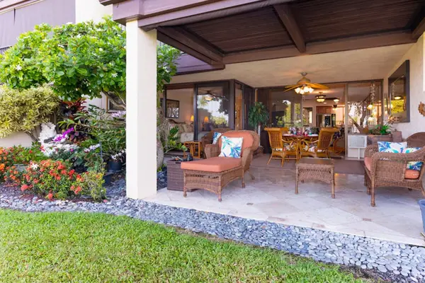 Covered Lanai Patio surrounded by Garden Greenery