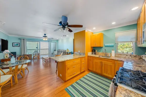 Enjoy cooking favorite recipes while dining together in this bright open living space