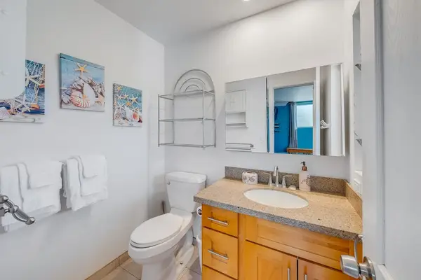 Clean half bathroom creates a welcoming space for quick refreshes and daily convenience