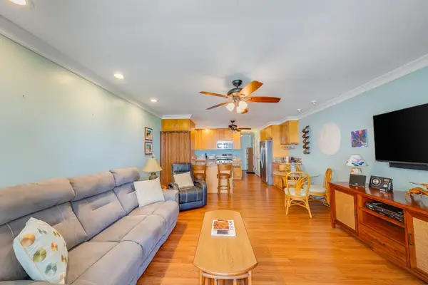 Thoughtfully designed living room offers comfortable seating and a bright welcoming atmosphere throughout