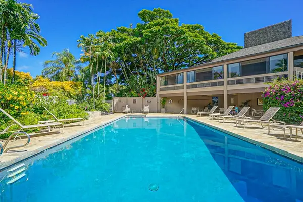 Scenic pool area offers refreshing swims surrounded by tropical landscaping and sunshine