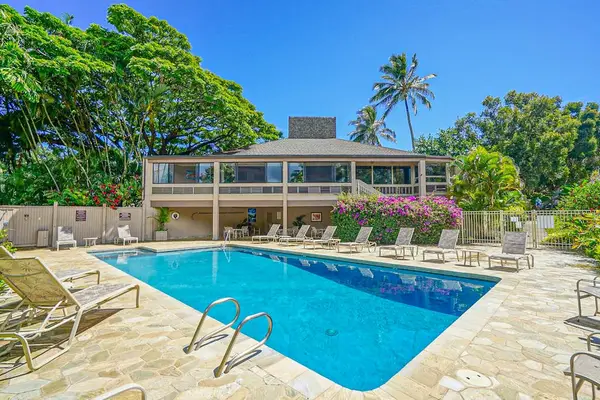 Tropical pool area offers refreshing swims beneath bright island sunshine