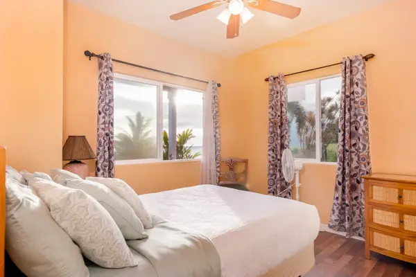 Bright Corner Bedroom With Tropical Views