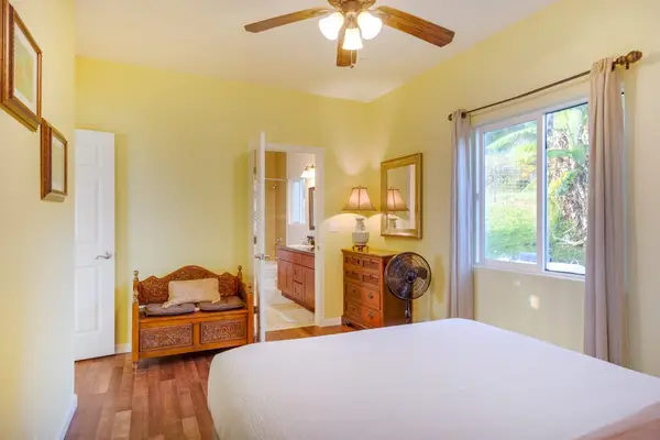 Comfortable Primary Bedroom Filled With Natural Light