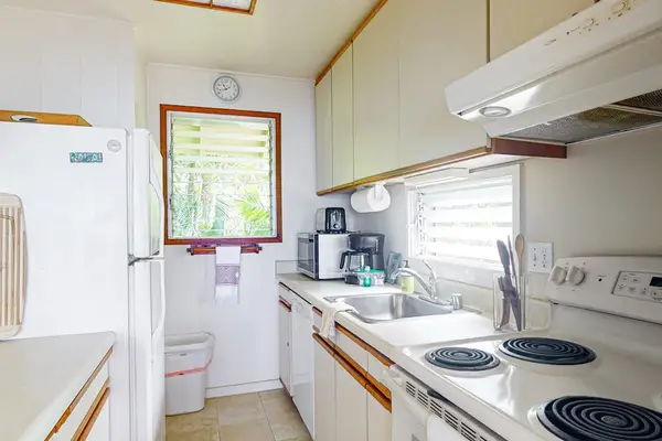 Well-equipped kitchen with modern appliances and ample counter space.