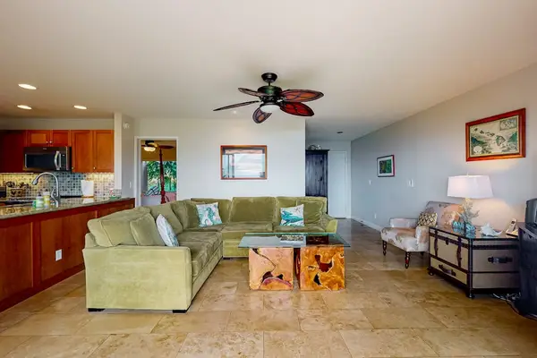 Bright living room showcases ocean views, woven accents, and seating