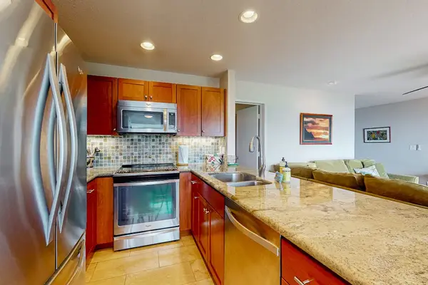Bright kitchen provides practical workspace, cooking equipment, and organized storage