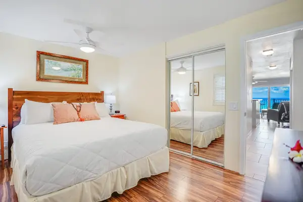 Comfortable Bedroom With Mirrored Closet