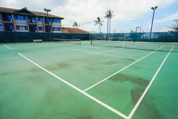 Sunny Tennis Court For Active Getaways