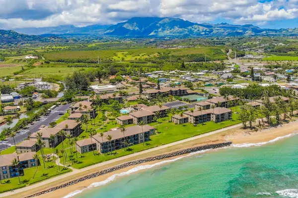 Aerial Coastal View With Mountain Backdrop