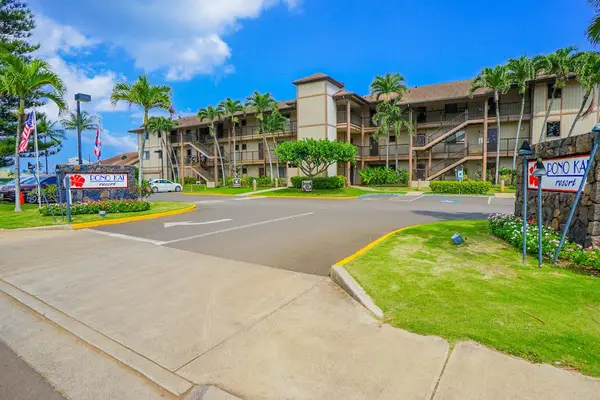 Welcoming Resort Entrance With Tropical Landscaping