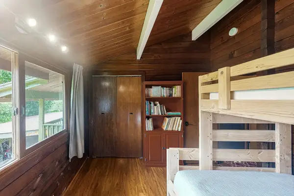 Guest room with bunk beds with a double and twin bed.