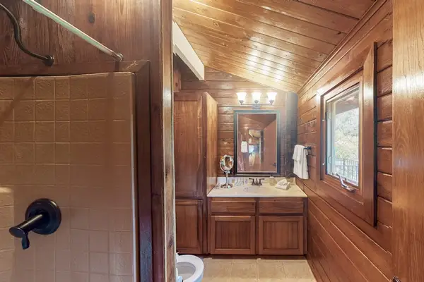 Full bathroom with a walk-in shower.