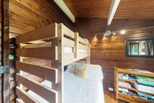 Guest room with bunk beds with a double and twin bed.