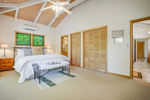 Spacious Primary Bedroom With Vaulted Ceilings