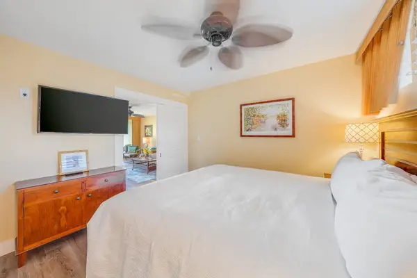 Relax in the bedroom with a TV and dresser for your convenience.
