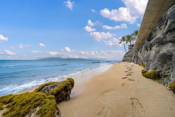 Unwind on the nearby sandy beach with beautiful ocean views.