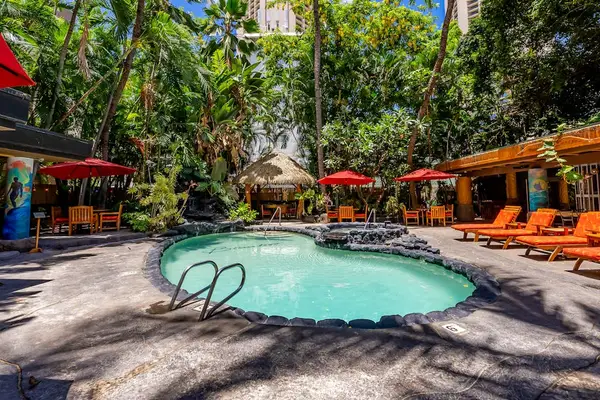 Enjoy easygoing poolside moments during your island getaway.