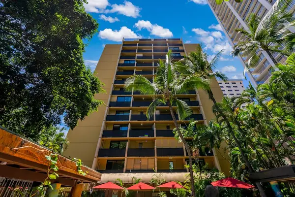 Discover the welcoming exterior of the property building as you arrive for your stay.