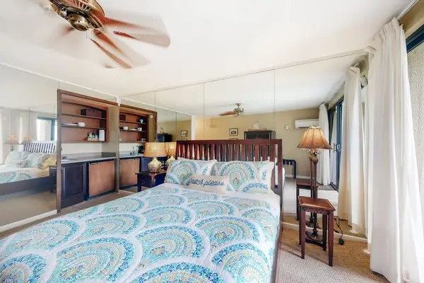 Spacious bedroom provides a relaxing setting for slow vacation mornings