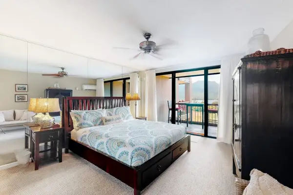 Rest comfortably in this spacious bedroom with refreshing outdoor views