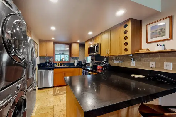 Prepare favorite meals easily in this spacious well-equipped modern kitchen