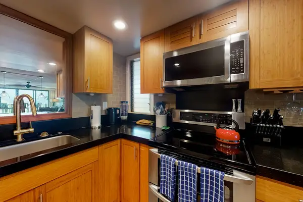 Enjoy convenient meal preparation in this warm well-equipped kitchen space