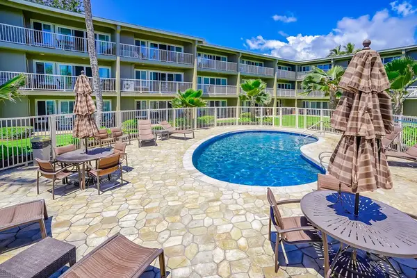 Resort pool with lounge chairs for sunny afternoons