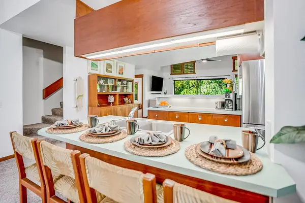 Four barstools for extra seating at the kitchen counter.