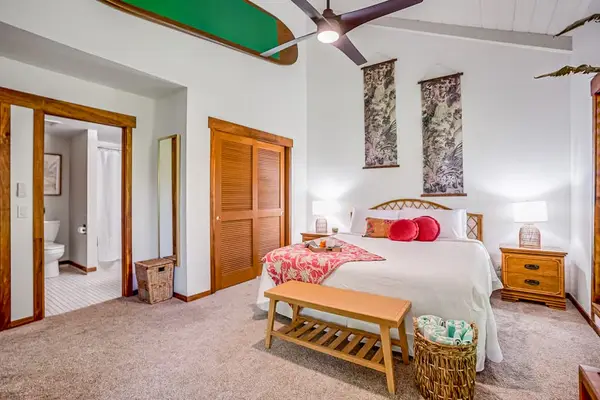 Master bedroom with king bed and ensuite bathroom.