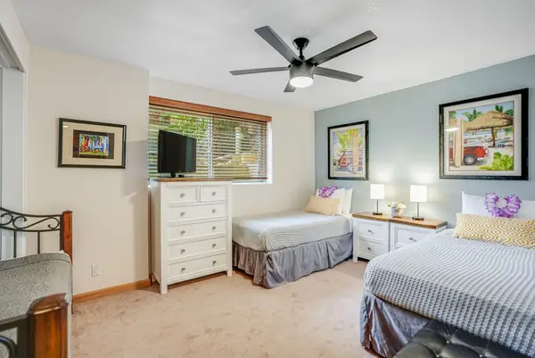 Small television visible from both twin beds