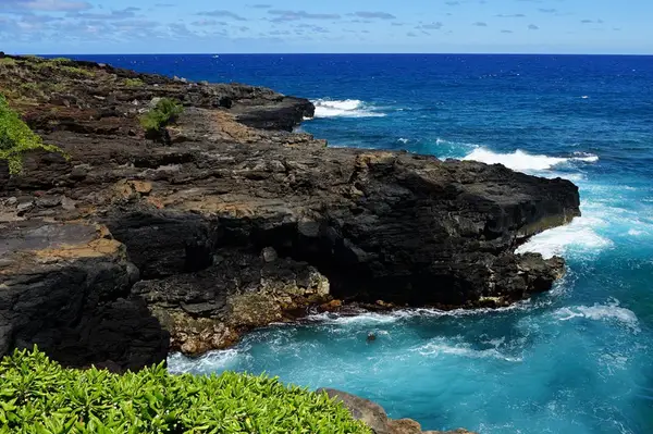 The area is known for its dramatic sea arch and geological formations