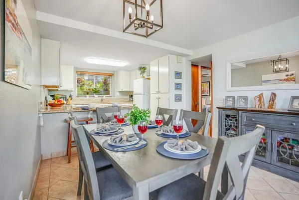Dining space flows directly into the modern kitchen, keeping everyone connected