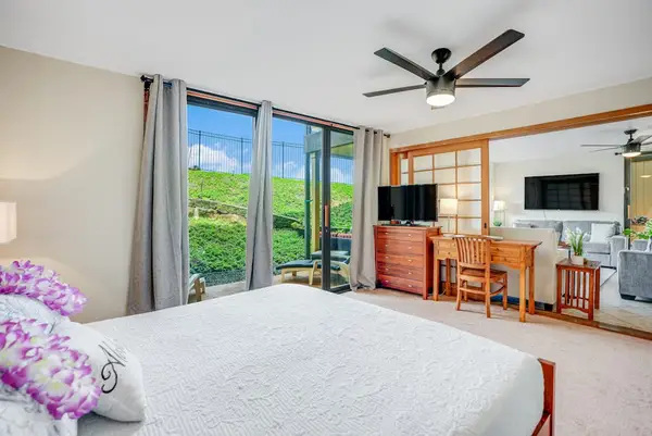 Small desk and television inside bedroom