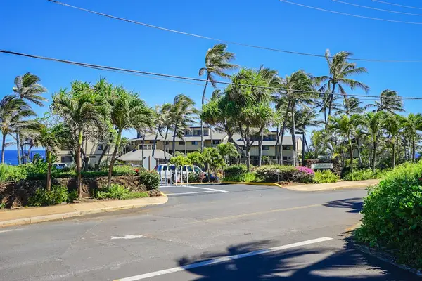 Makahuena at Poipu condominium resort surrounded by lush palm trees