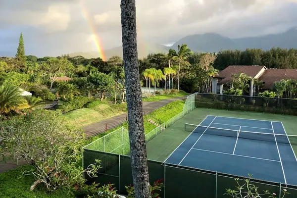 Stay active on tennis courts surrounded by beautiful tropical scenery