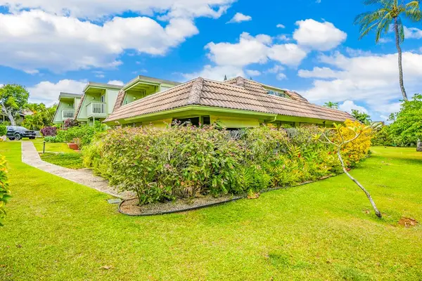 Sprawling Green Lawns & Vibrant Tropical Foliage Surrounding the Unit