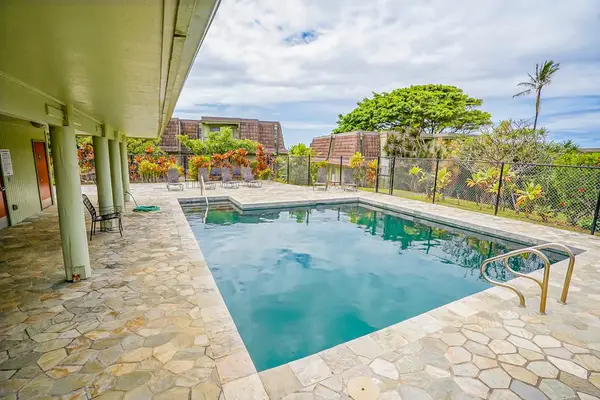 Resort-Style Community Swimming Pool with Sun Loungers & Deck