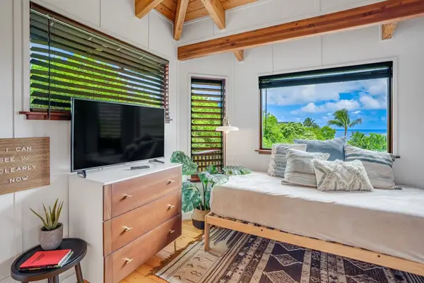 Primary suite with comfortable Kind bed and a TV